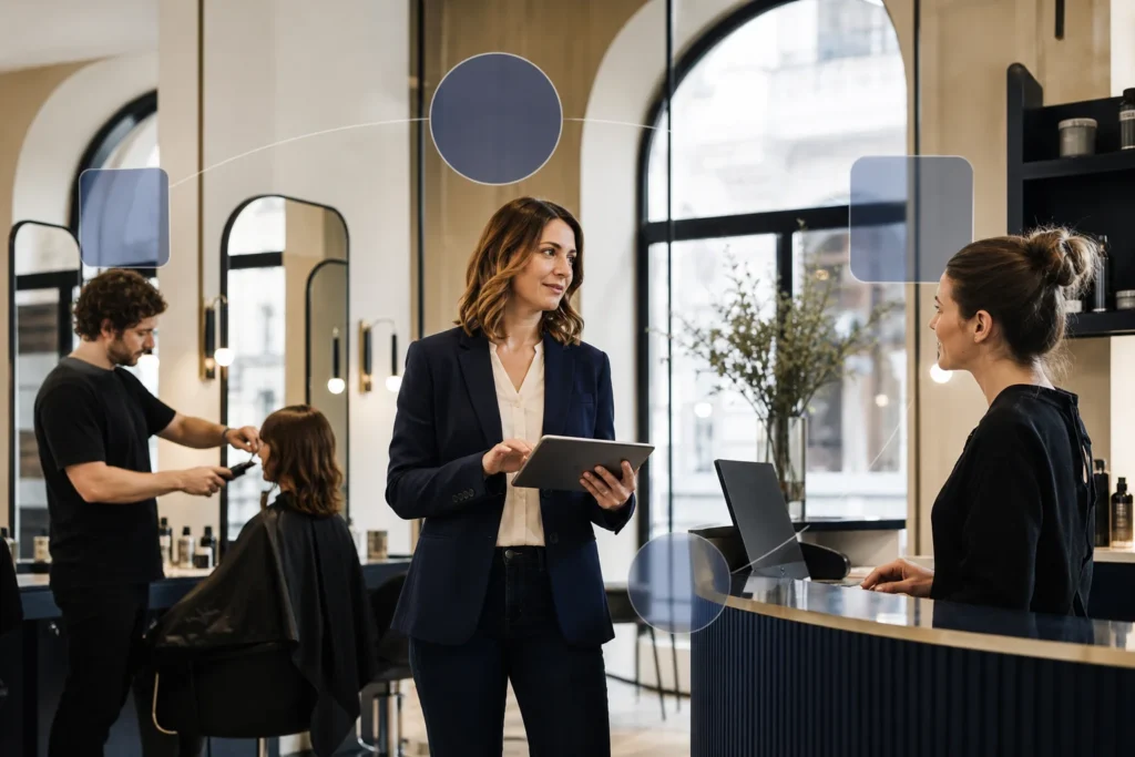 Salon manager coordinating digital workflows with her team